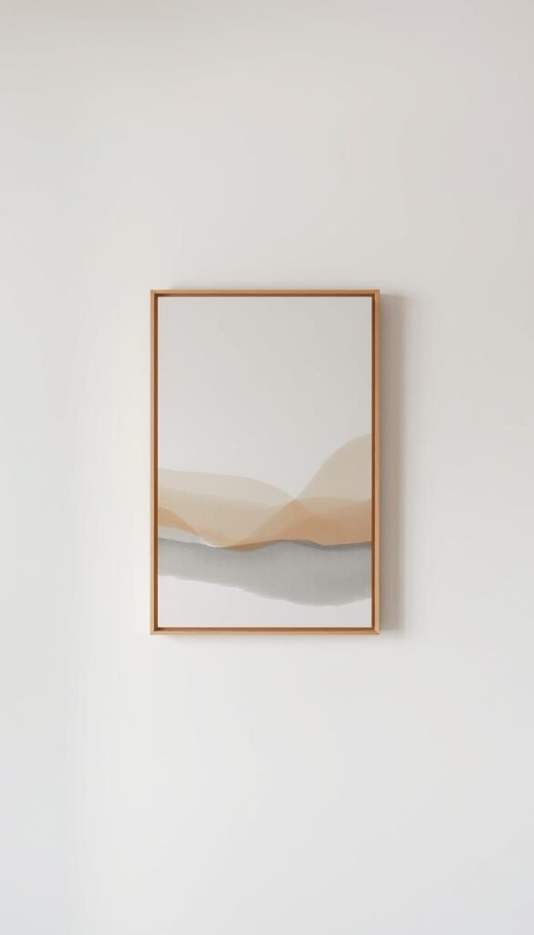 A serene minimalist wall, with a single abstract canvas in muted tones of beige, taupe, and soft gray. The canvas is framed in a sleek, minimalist wooden frame, positioned in the center of the wall. The lighting is soft and diffused, creating a calming, zen-like atmosphere. The background is a plain, off-white wall, allowing the artwork to be the focal point. The overall composition is balanced, with clean lines and a harmonious color palette, reflecting the essence of minimalist design.